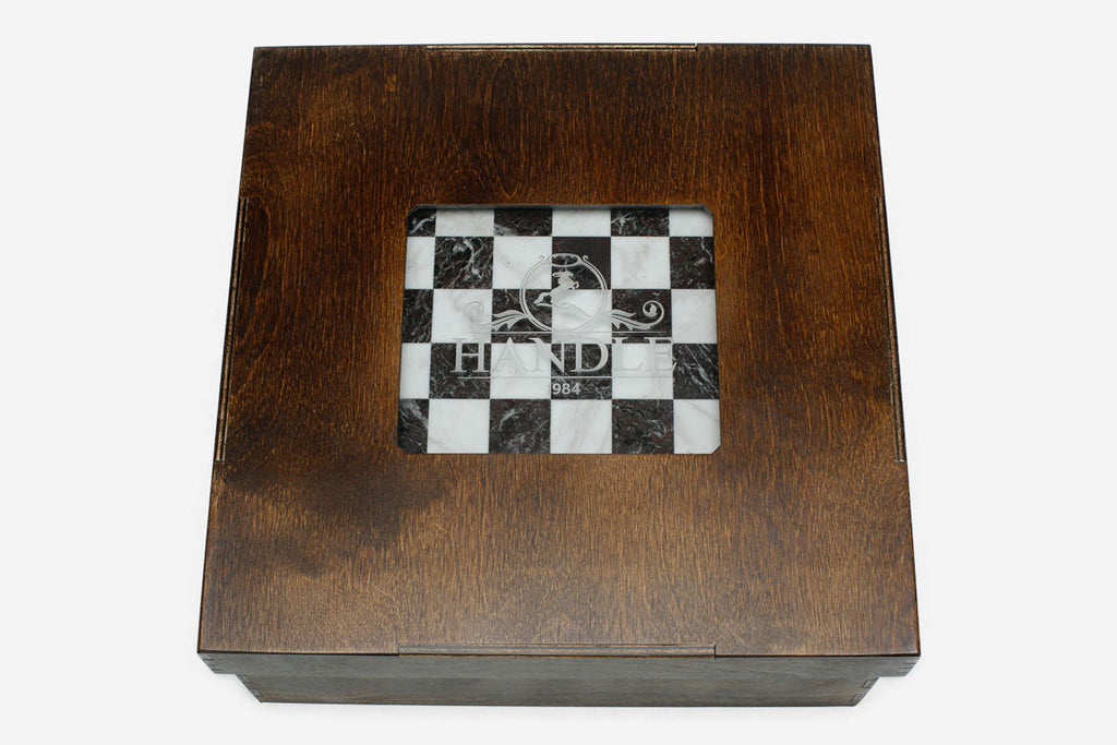 Wooden gift box with a viewing window showing the burgundy and white marble board