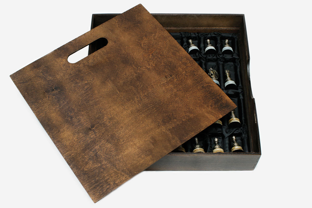 Golden marble chess set with bronze pieces and brass coordinate markers