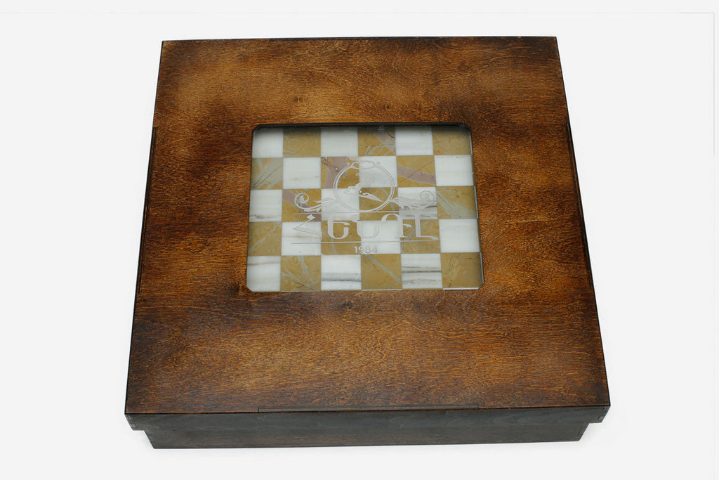Detail of the golden marble chess set with bronze pieces