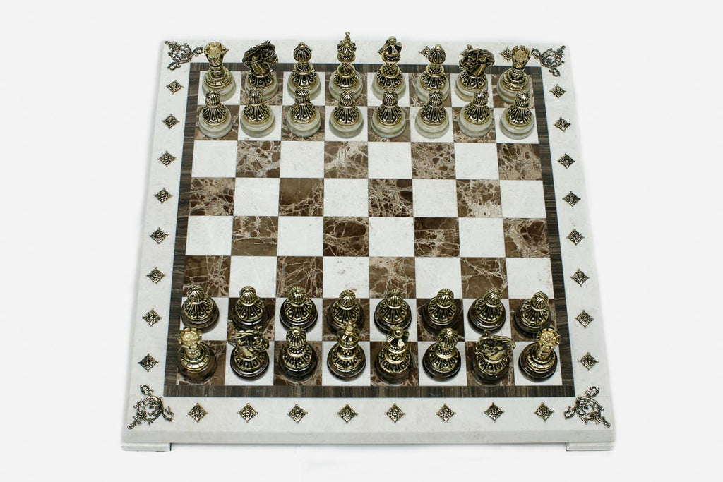 Cream and brown marble chess set with hand-cast bronze pieces arranged for play and brass coordinate markers