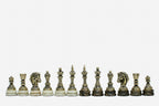 Row of the two-tone bronze chess pieces on marble bases, showing kings, queens, bishops and horse-head knights