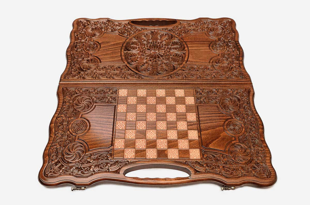 Angled view of the baroque ornament carved backgammon board