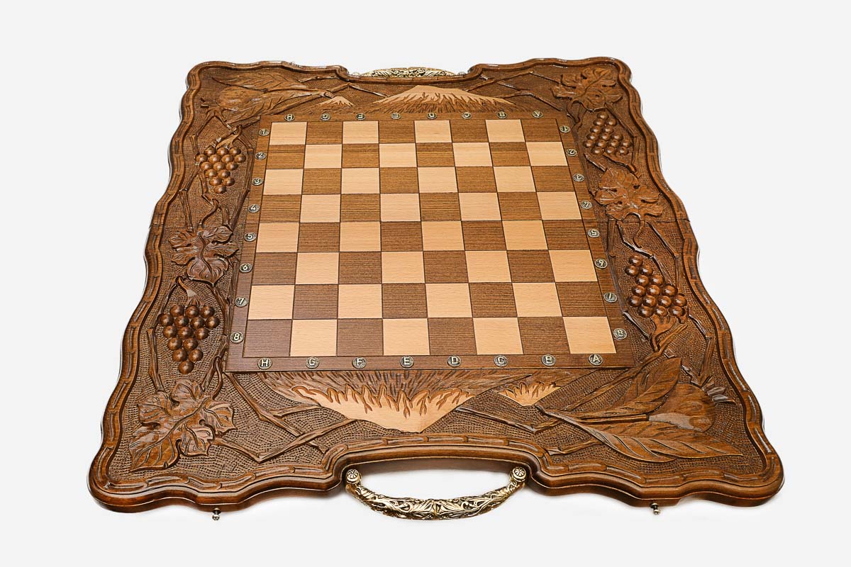 Figural bronze chess pieces standing on the Ararat board