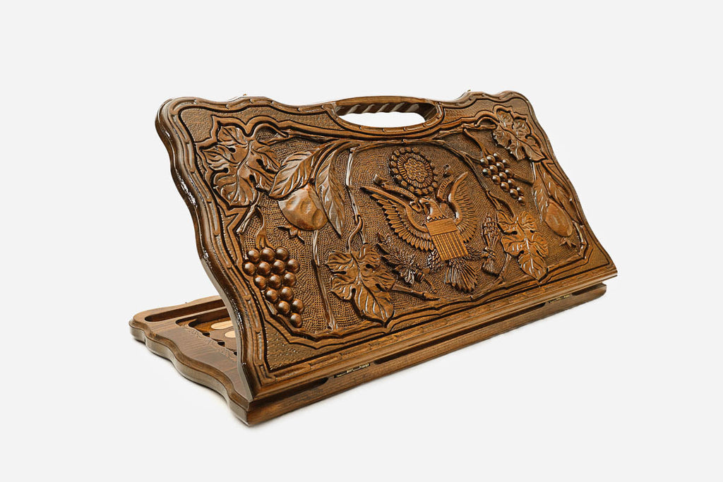 Carved beechwood backgammon board with the American coat of arms and a carry handle, propped open