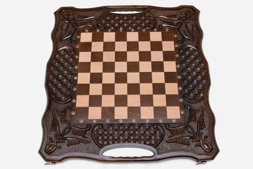 Angled view of the carved folding chess set with its beech and walnut pieces