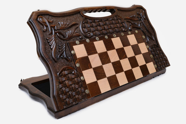 Luxury carved chess set standing open, showing the playing field, woven ornament carving and built-in carry handle