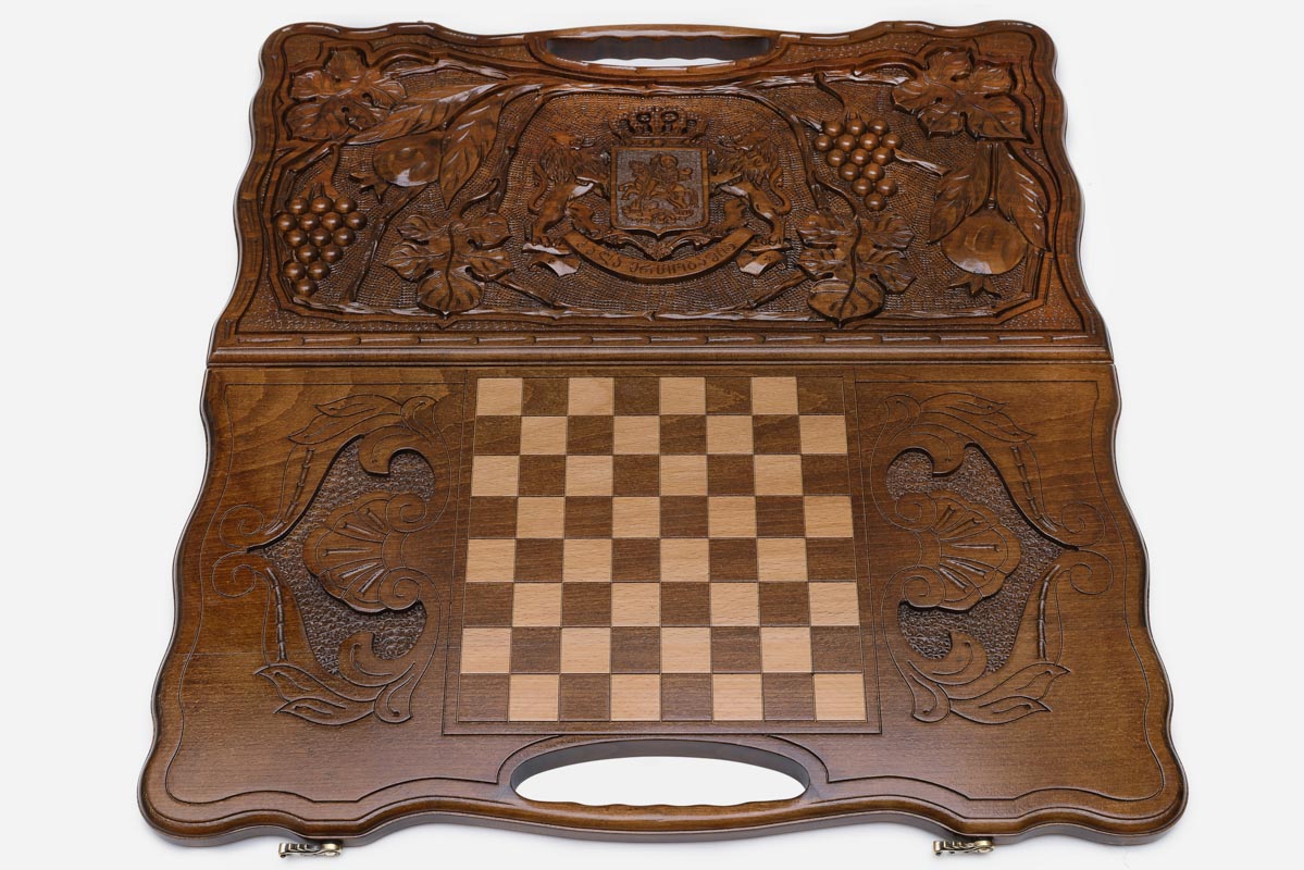 Angled view of the Georgian crest carved backgammon board