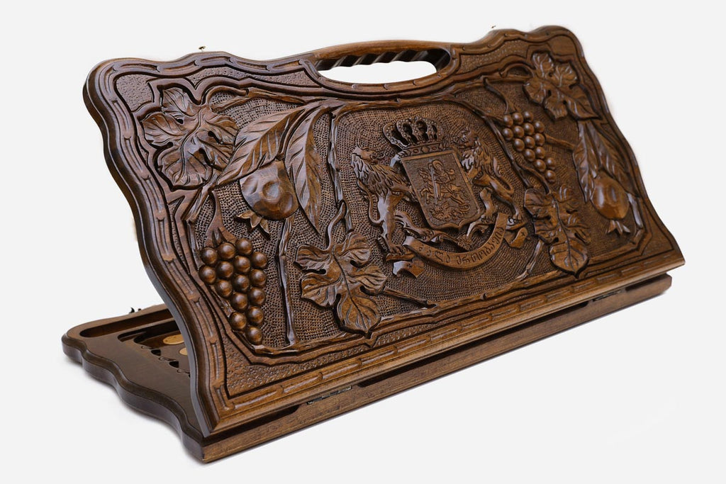 Carved beechwood backgammon board with the Georgian coat of arms and a carry handle, propped open