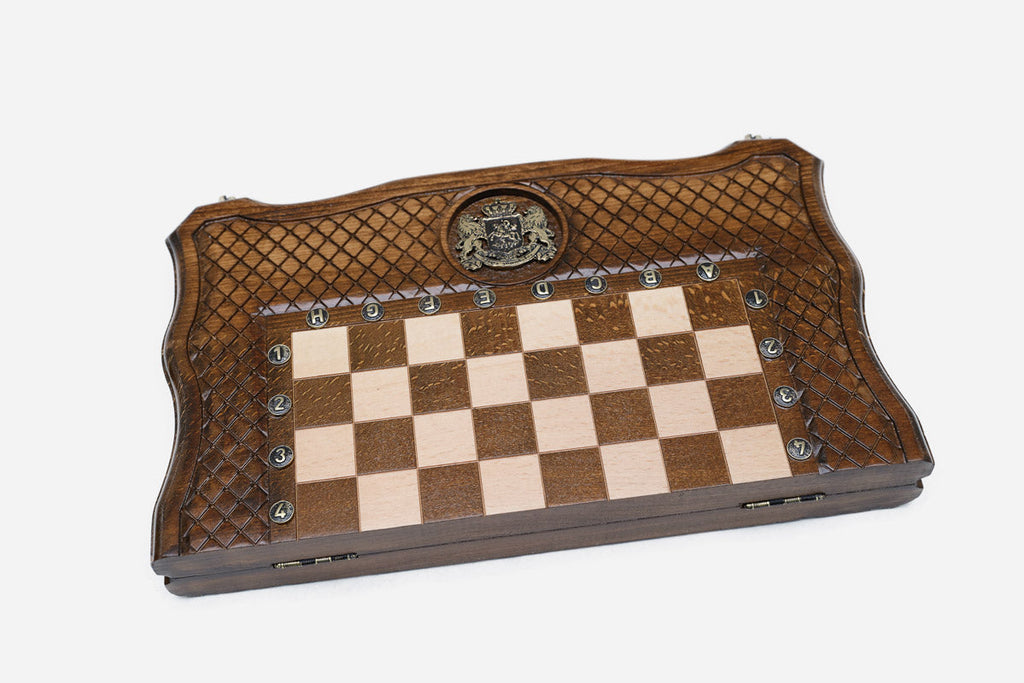 Carved knight and dragon on the Georgian chess board
