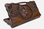 Carved beechwood backgammon board with a lion and spider webs, with a carry handle, propped open