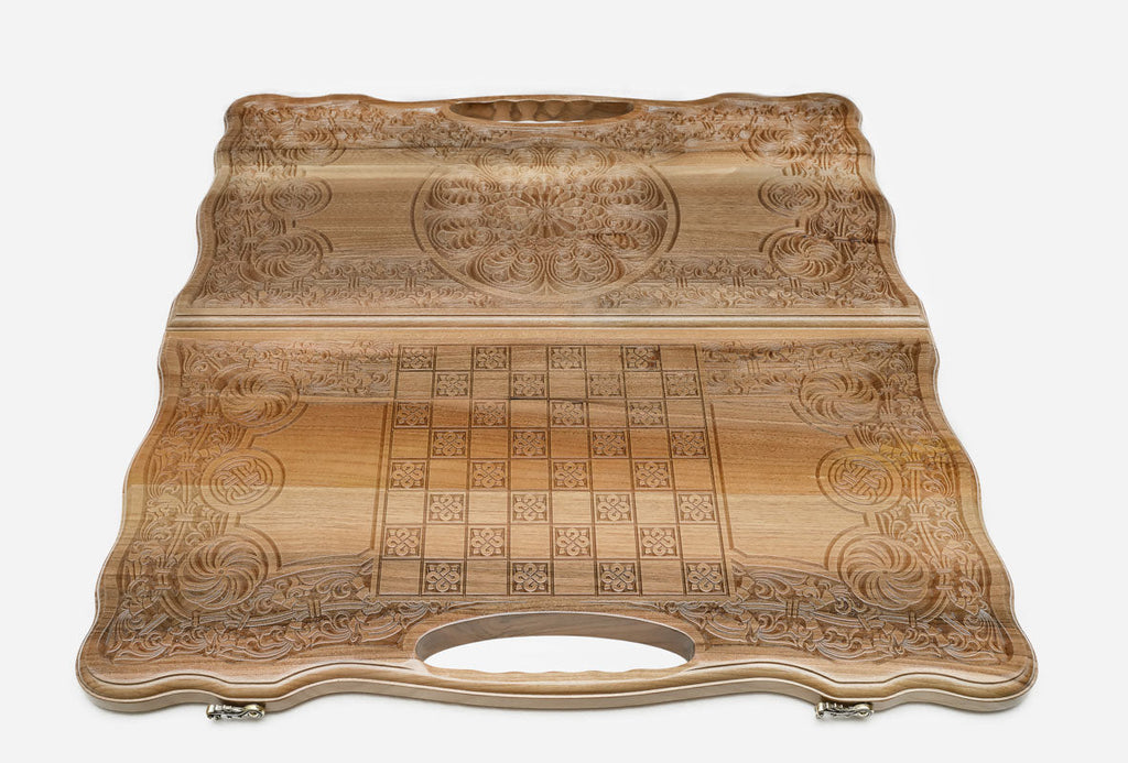 Walnut backgammon set folded with its built-in carry handle