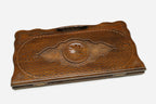 The backgammon board opened to show the wooden playing surface