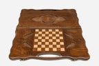 Angled view of the eternity sign carved backgammon board