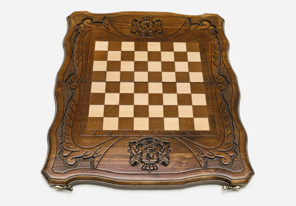 St. George and dragon carved on the wooden chessboard