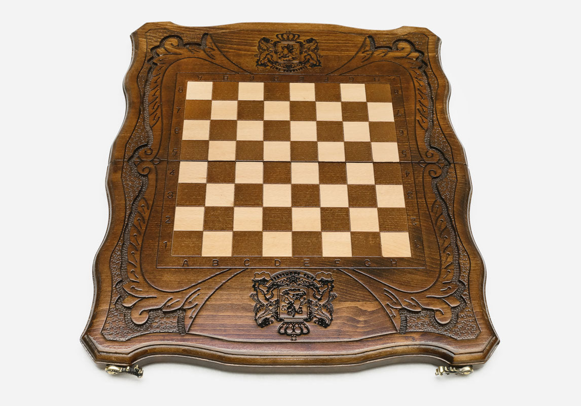 St. George and dragon carved on the wooden chessboard