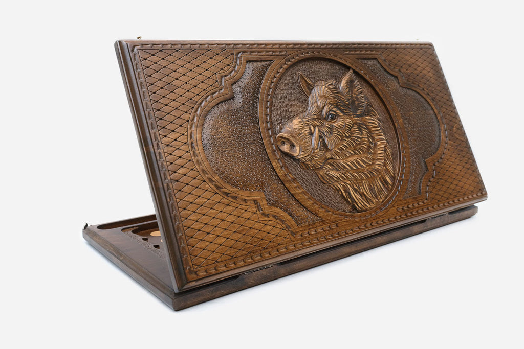 Wooden backgammon set hand carved with a charging wild boar