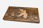 Carved reverse face of the swans backgammon set
