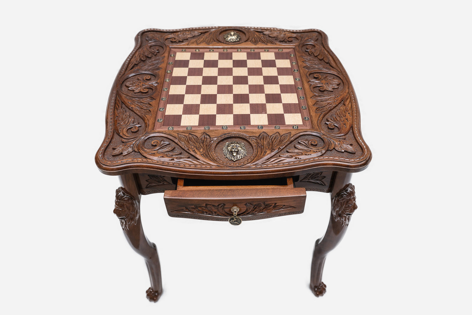 Lion chess table, bronze pieces close-up