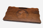 The backgammon board opened to show the wooden playing surface
