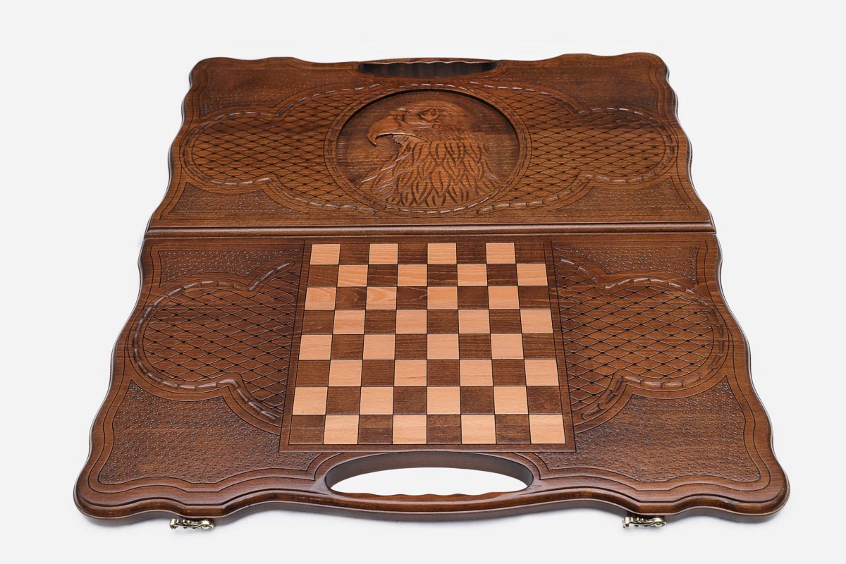 Angled view of the eagle head carved backgammon board