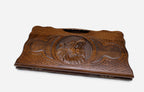The backgammon board opened to show the wooden playing surface