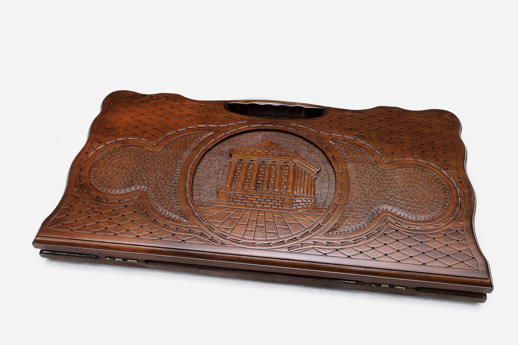 The backgammon board opened to show the wooden playing surface