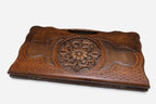 The backgammon board opened to show the wooden playing surface