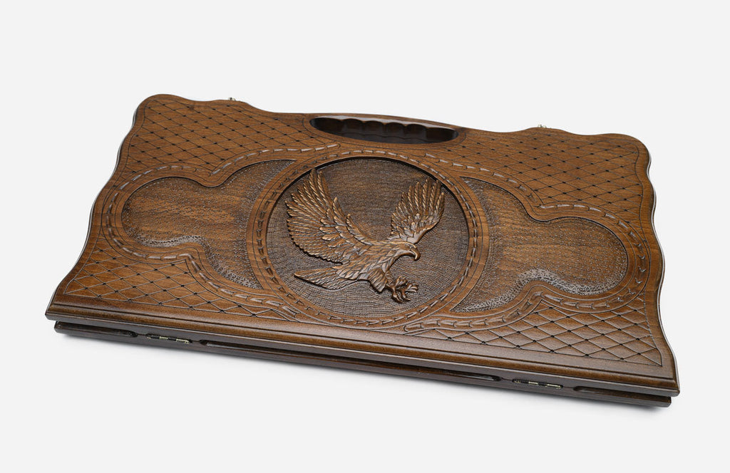 The backgammon board opened to show the wooden playing surface