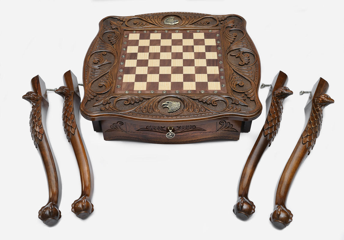 Eagle chess table, bronze pieces close-up