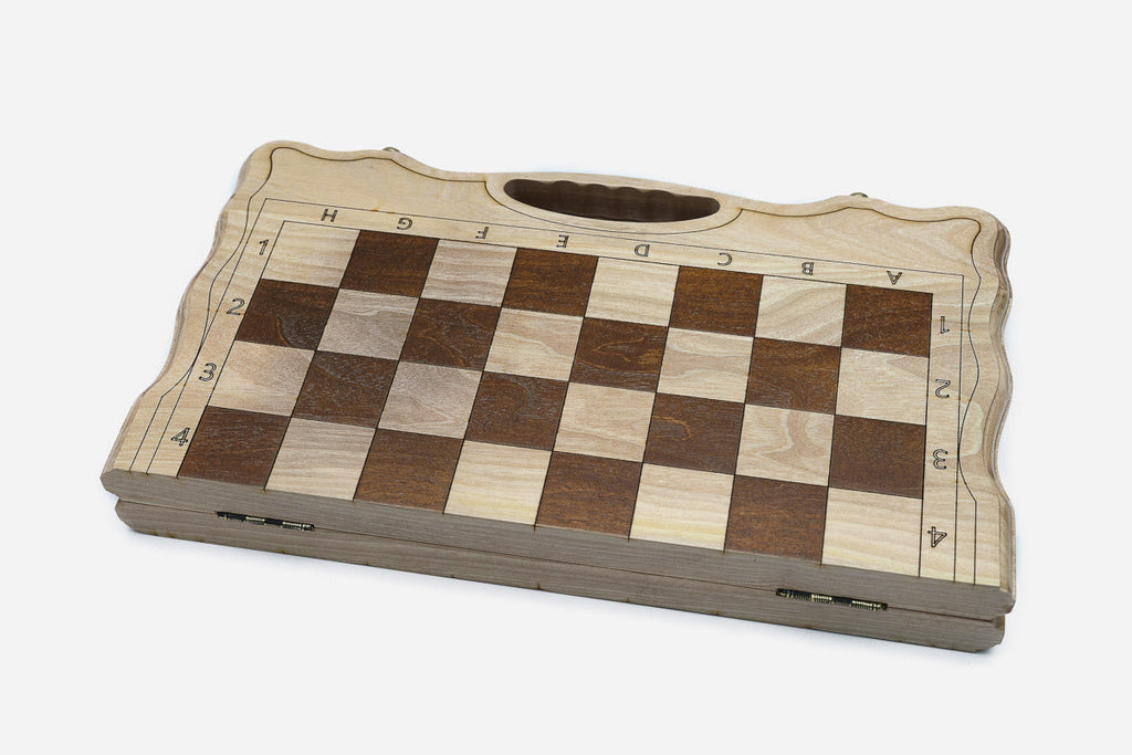 Top-down view of the opened board showing the maple and walnut squares and carry handle