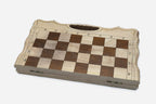 Top-down view of the opened board showing the maple and walnut squares and carry handle