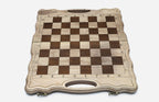 Overhead view of the chess board with the full set of 32 bronze pieces