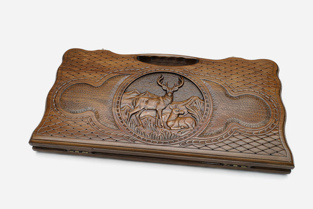 The backgammon board opened to show the wooden playing surface