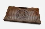 The backgammon board opened to show the wooden playing surface