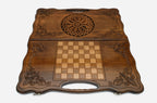 Angled view of the ornate ornament carved backgammon board