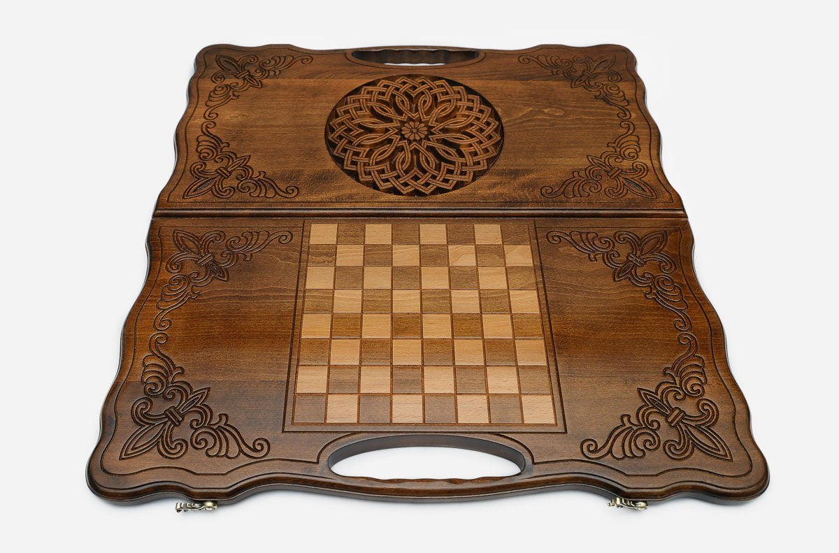 Angled view of the ornate ornament carved backgammon board