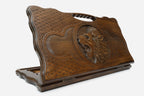 Carved beechwood backgammon board with a roaring lion and a carry handle, propped open