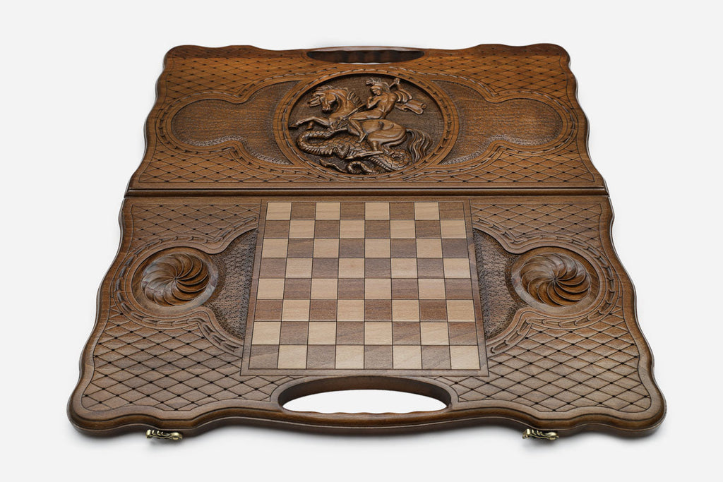 Angled view of the Saint George carved backgammon board