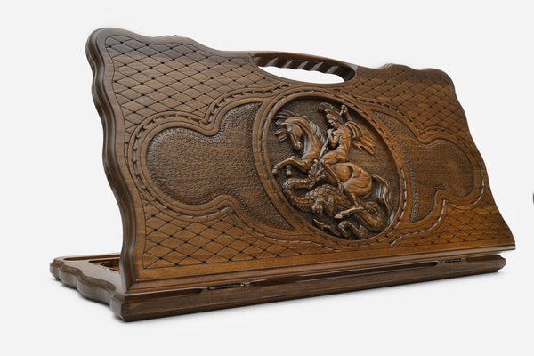 Carved beechwood backgammon board with Saint George slaying the dragon, with a carry handle, propped open