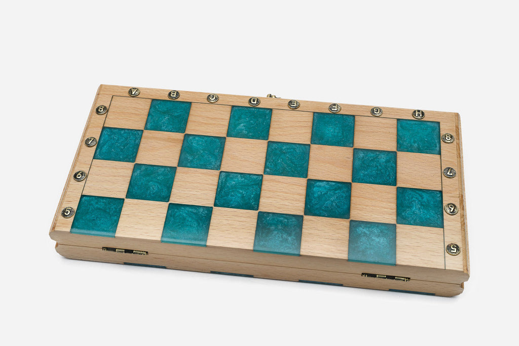 Detail of the teal epoxy squares and brass markers