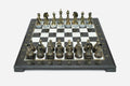 Black marble chess set with hand-cast bronze pieces arranged for play and brass coordinate markers