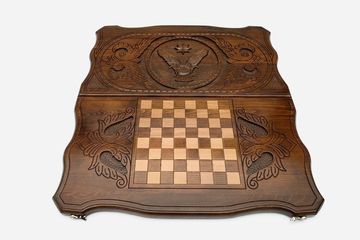 Carved eagle inside a bold octagon frame - wooden backgammon board detail