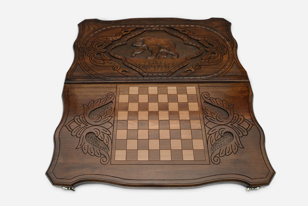 Upright heavy-shouldered bear hand-carved in wood - backgammon board detail