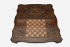 Upright heavy-shouldered bear hand-carved in wood - backgammon board detail