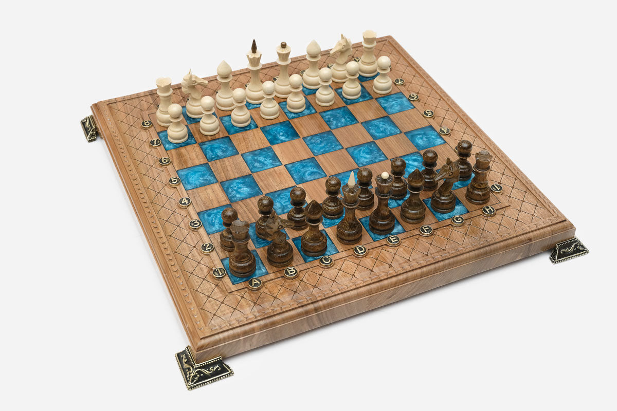 Angled view of the blue epoxy chess set with its wooden pieces