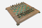 Overhead view of the green epoxy board and full set of figural pieces