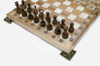 Close-up of the beech and walnut chess pieces on the white epoxy squares