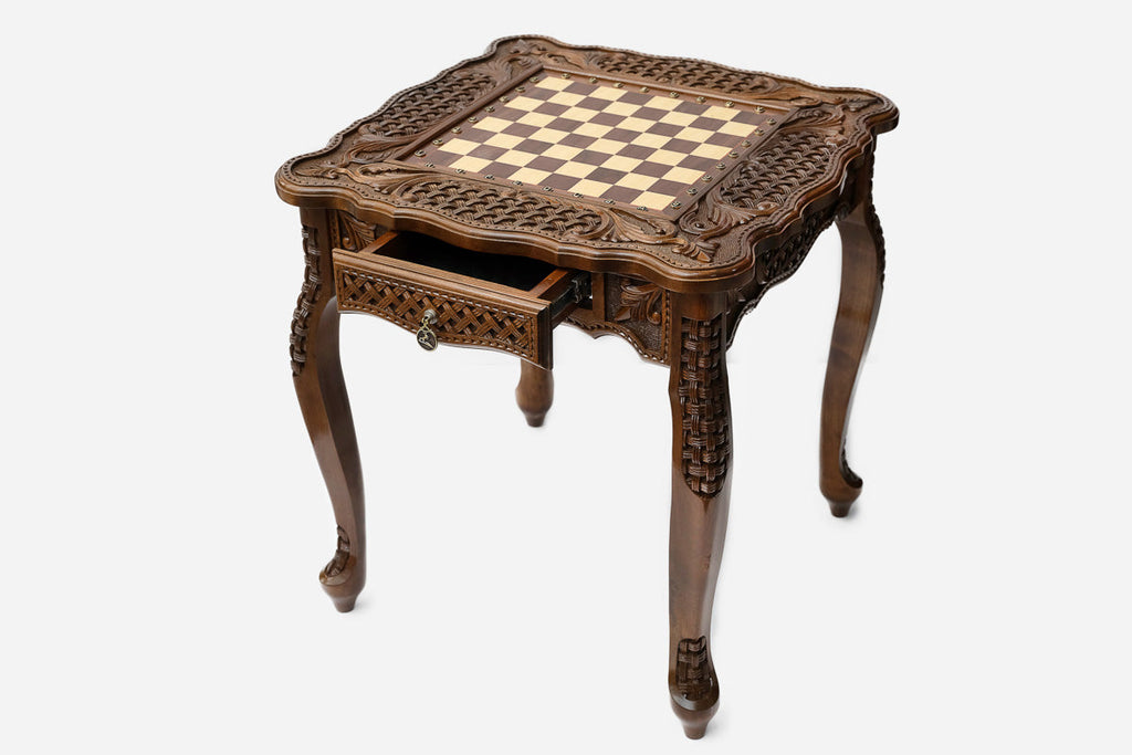Carved chess table, angled view