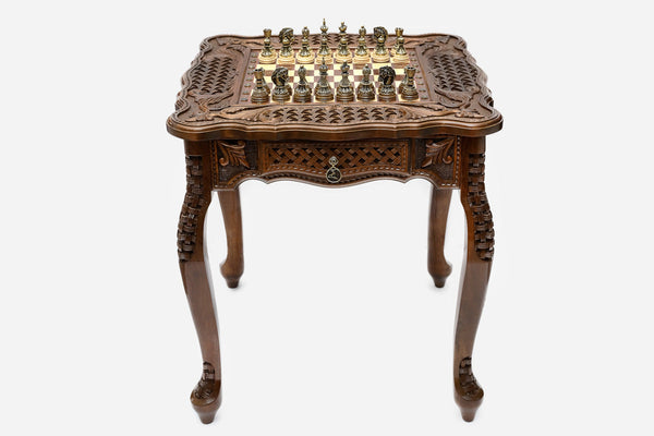 Carved chess table with figural bronze pieces