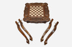 Carved chess table, playing surface with bronze pieces